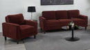 Maroon sofa set with matching armchair and loveseat in a living room setting.